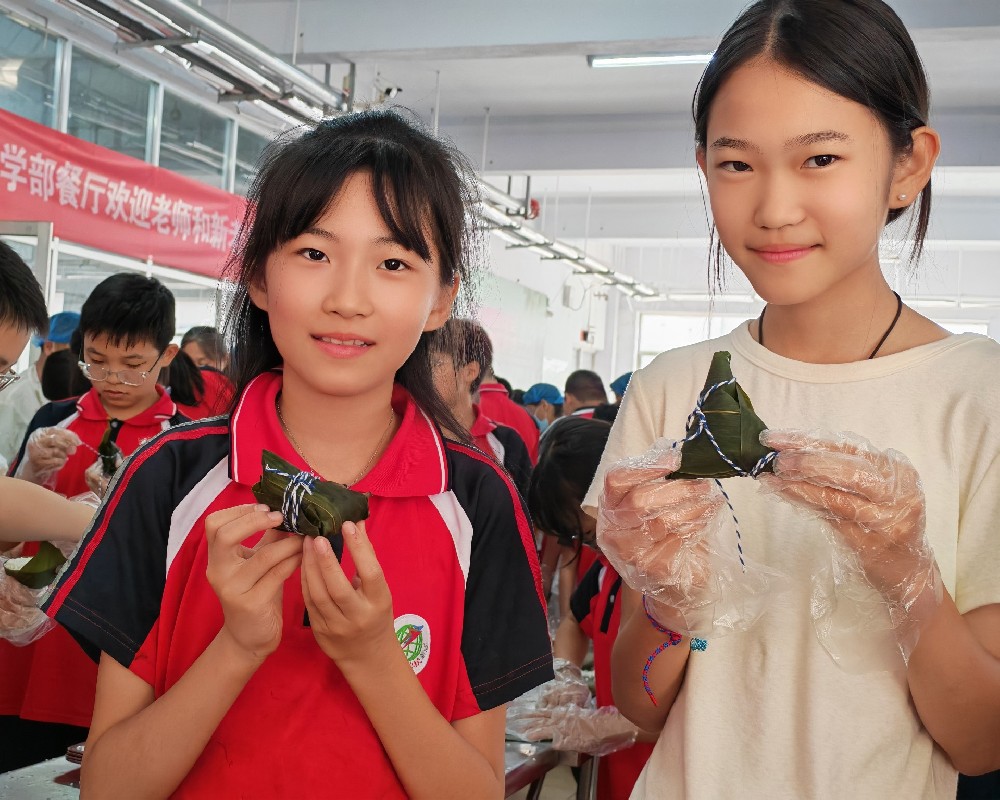 粽叶飘香迎端午，文化传承润童心 ——跃华学校小学部五年级包粽子主题活动